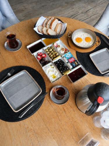 a table with a bunch of breakfast foods on it at Hiper Suites Residance in Antalya