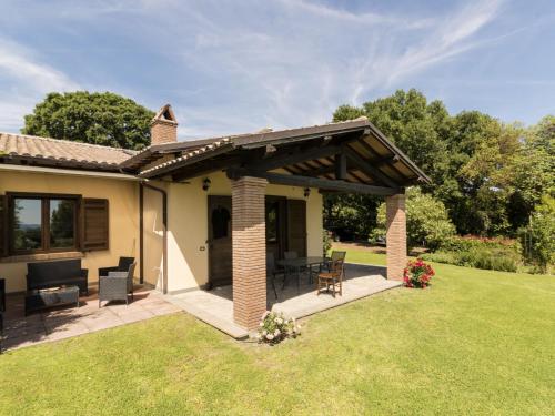 a patio with awning on top of a house at Holiday Home Rosa Tea by Interhome in Bolsena