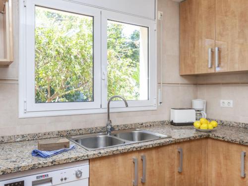 a kitchen with a sink and a window at Holiday Home Bretos by Interhome in Fonts