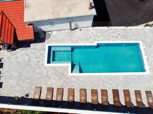an overhead view of a swimming pool on a house at Apartment Delfin-2 by Interhome in Cesarica