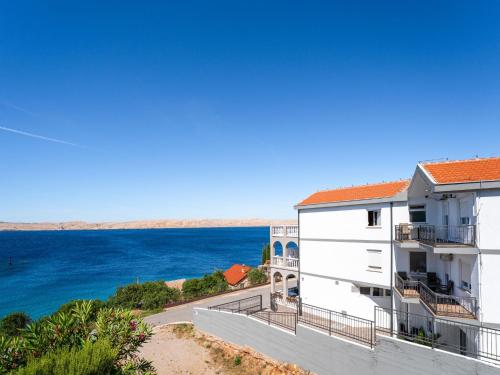 a view of the ocean from the balcony of a building at Apartment Delfin-10 by Interhome in Cesarica
