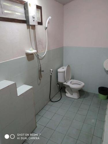 a bathroom with a shower and a toilet at OK Bungalow in Ko Tao