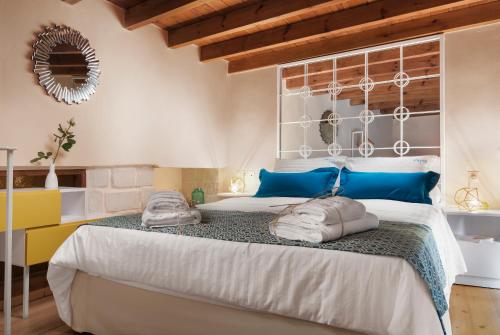 מיטה או מיטות בחדר ב-Aeria Apartments