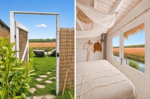 a bedroom with a bed and a view of a field at Beach HideAway in Noordwijkerhout