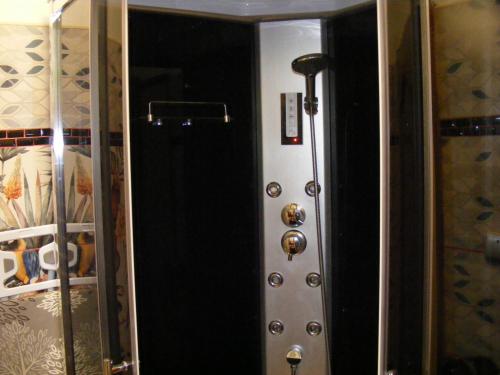 a room with a door with a bunch of buttons at Négy Gólya in Sarud