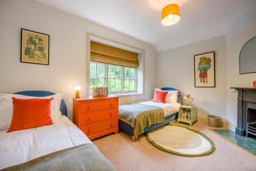 a bedroom with two beds and a fireplace at 5 Bed in Church Stretton oc-t30413 in Church Stretton