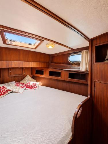 a bed in the back of a boat at Che Manovra - A Night Onboard! in Porto San Paolo