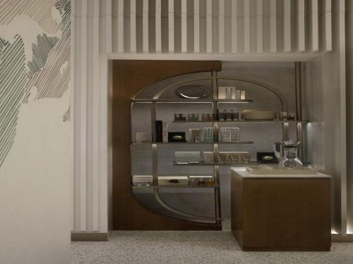 a kitchen with a sink and a shelf in a room at SO/ Uptown Dubai in Dubai