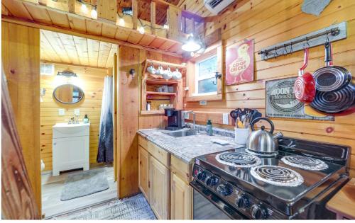 a kitchen with a stove and a sink in a cabin at Shiners Shack in Newport