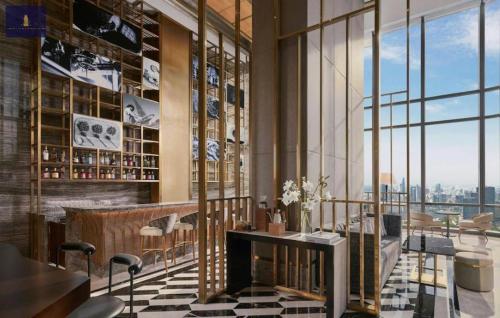 a restaurant with a table and a view of the city at Landmark 81 Exclusive Panorama Residence in Ho Chi Minh City