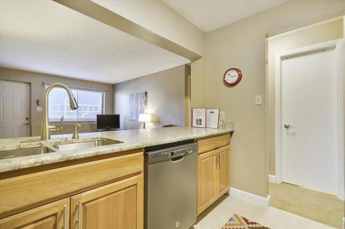 a kitchen with a sink and a dishwasher at Tannhauser 225 in Breckenridge
