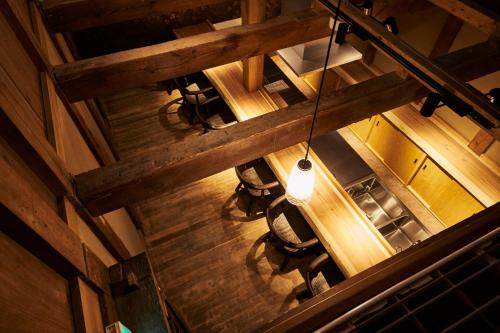 an overhead view of a table and chairs in a kitchen at Ubusuna no Sato TOMIMOTO in Ando