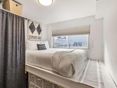 a bedroom with a large bed and a window at Edelweiss 12 in Breckenridge