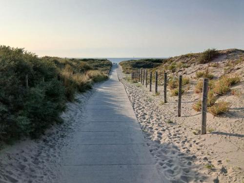 a path through the sand on the beach at Sunny Side at the Sea in Hoek van Holland