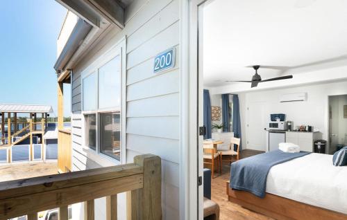 a bedroom with a sign on the side of a house at The Silver Lake Hotel at Ocracoke in Ocracoke