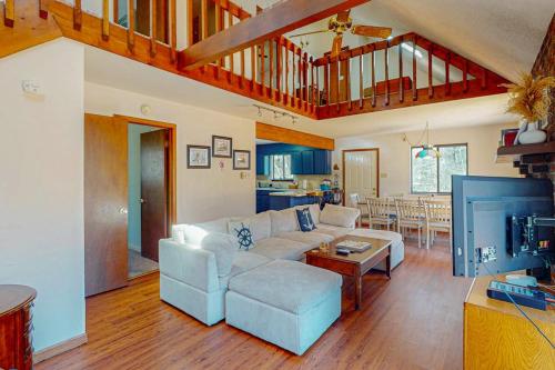a living room with a couch and a table at The Burrow in Jim Thorpe