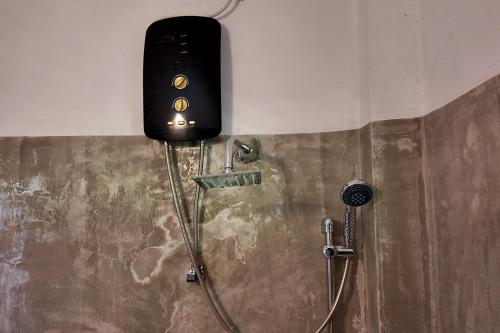 a shower in a bathroom with a shower head at Nil Nadiya Holiday Resort in Matara