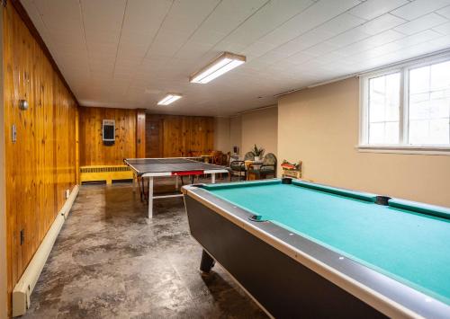 a billiard room with a pool table in it at 2BR 1BA Cabin #8 at Riverside Point Resort in Park Rapids