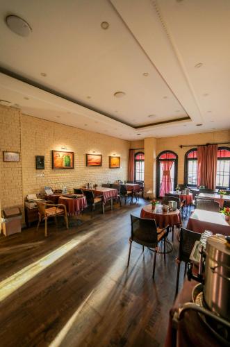 a restaurant with tables and chairs in a room at Astro Suites in Istanbul