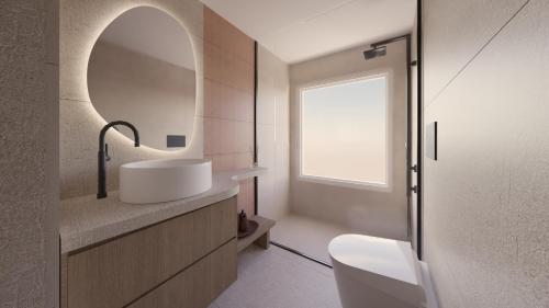 a bathroom with a sink and a mirror at Pharos by Premium Key in Skiathos
