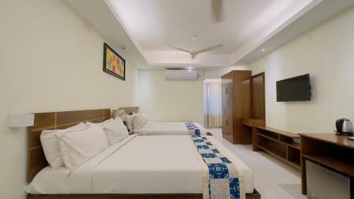 a hotel room with a bed and a television at Hotel The Grand Hyatt Dhaka in Dhaka
