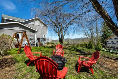 a group of chairs sitting around a fire in a yard at A Place Apart in Blowing Rock