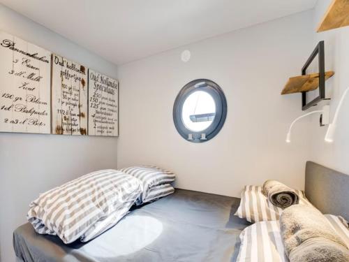 a bedroom with a bed and a mirror at Le Belle Vie in Volendam