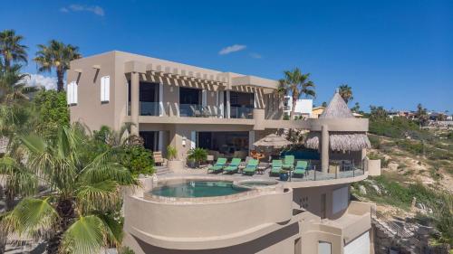 an aerial view of a house with a swimming pool at Views to El Arco, Famous Cabo San Lucas bay rock formation in El Pueblito