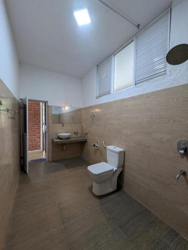 a bathroom with a toilet and a sink at Brisk Ella Retreat in Ella