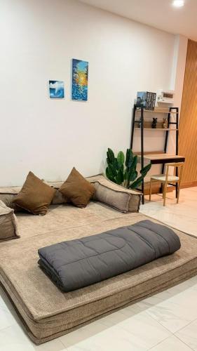 a large bean bag bed sitting on a floor at Hatyai marina Villa in Ban Khlong Hae