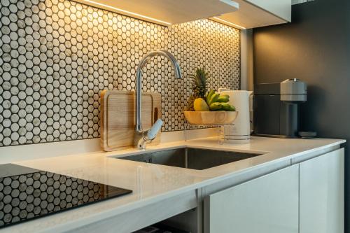 a kitchen with a sink and a counter top at Serenity by Pavol in Ban Bo Han