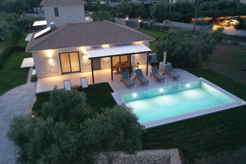 an aerial view of a house with a swimming pool at Anagallis Villas in Lefkada
