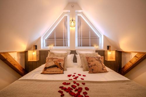 a bedroom with a bed with a large window at EnergyZen - Spa Alsace - le Refuge des Anges in Bischoffsheim