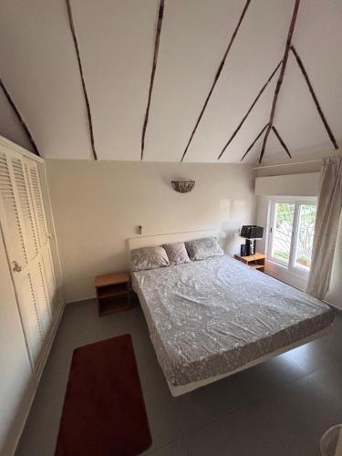 a bedroom with a bed in a room at Residence Mangrove Saly in Ngaparou