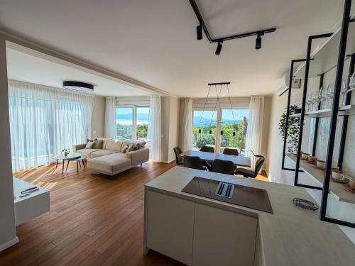 a large living room with a couch and a table at VILLA MARIS SMRIKA -heated pool in Šmrika