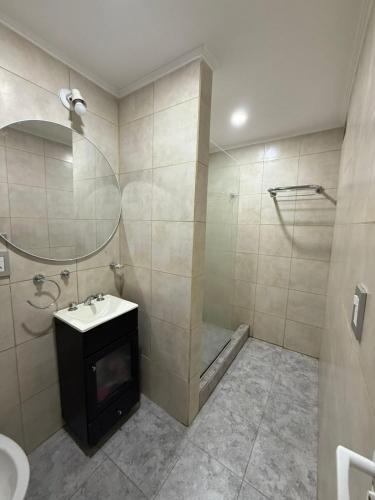 a bathroom with a shower and a sink and a toilet at La Seven Dpto Turístico in Colón