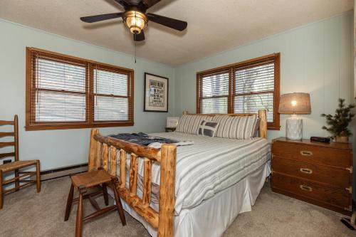 a bedroom with a bed and a ceiling fan at Eagle Point - Powder Horn Mountain in Powderhorn Mountain