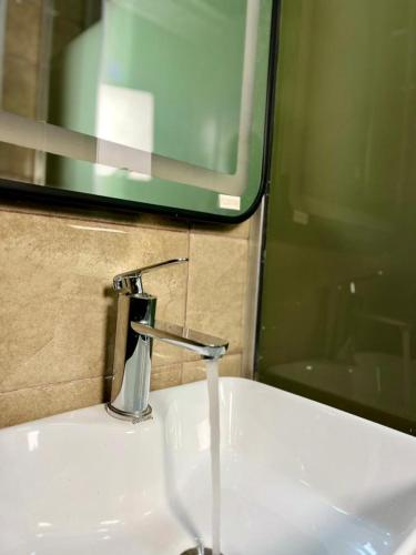 a sink with a faucet in a bathroom at Valley in Kado