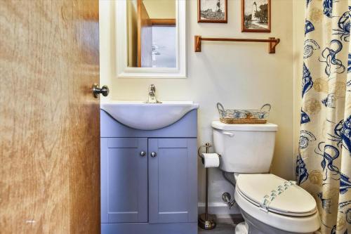 a bathroom with a sink and a toilet at Hurricane Charlie's in Duck