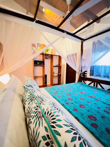 a bedroom with a bed in a tent at Onadi House in Galle
