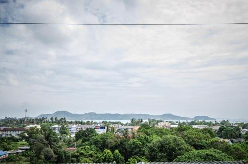 a view of a city with mountains in the background at Casa Bella Phuket in Chalong 