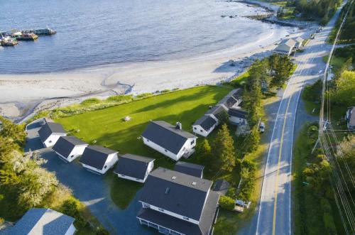 an aerial view of a beach with houses and the water at Hunts Point Beach Cottages - Cottage #2 in Summerville Centre