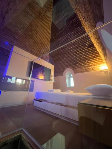 a bedroom with a large white bed in a room at The Tower Roma in Rome