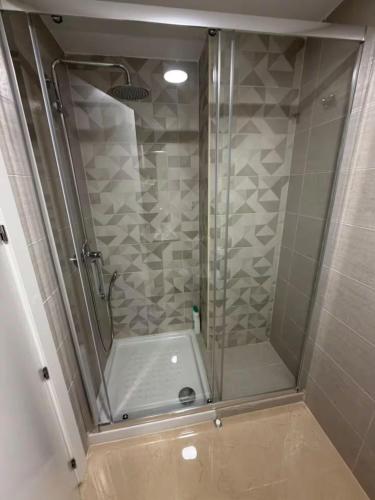a shower with a glass door in a bathroom at Costa Azahar - En Primera Línea in El Borseral