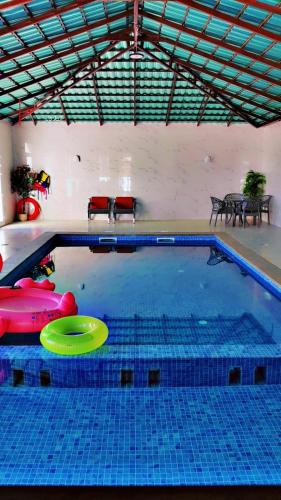 a swimming pool with a frisbee in the water at استراحة الوداد in Qurayyah