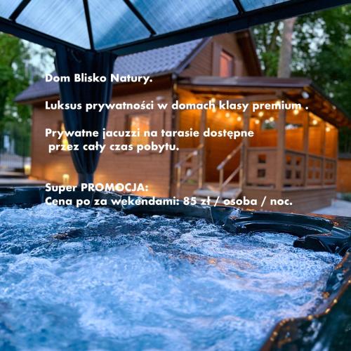 a water slide in front of a house at Dom Blisko Natury Brenno in Brenno