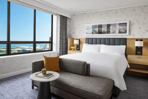 a hotel room with a bed and a couch at The Ritz-Carlton, Chicago in Chicago