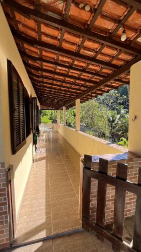 a porch of a building with a wooden roof at Casa Recanto in Angra dos Reis