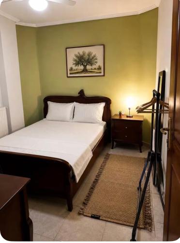 a bedroom with a bed with a camera on a tripod at HOUSE WITH GARDEN Netflix in Néa Kerasiá