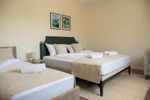 two beds in a hotel room with at Mostay Boutique Hotel in Mostar